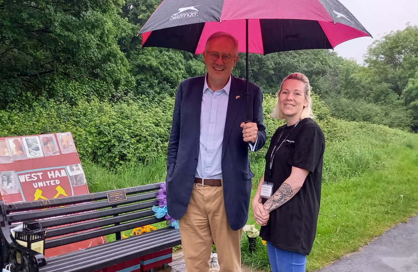 John with Karen Pullen by the Memorial Bench for Craig in the park where he ended his life