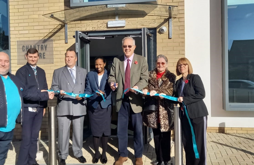 •	the Barclays team and Town Council representatives helping John to cut the ribbon [L-R Stuart Pugh (Barclays Customer Care Leader), Alain Lipton (Barclays Branch Manager), Martin Mordecai (Billericay Town Councillor), Flo Johnson (Barclays Area Director for Essex), John, Marie Dear (part of the Town Council), Deborah Tonkiss (Town Clerk)] 